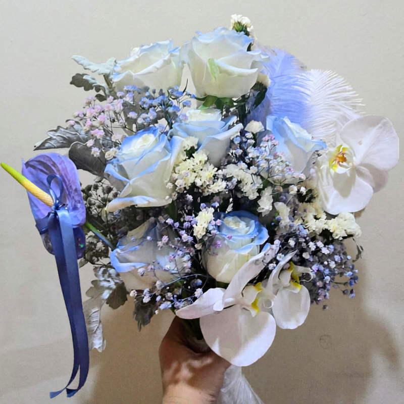 Bespoke blue-toned congratulatory bouquet with pale blue roses and Phalaenopsis orchids, for a dancer after her performance, Jiyu Florals Singapore