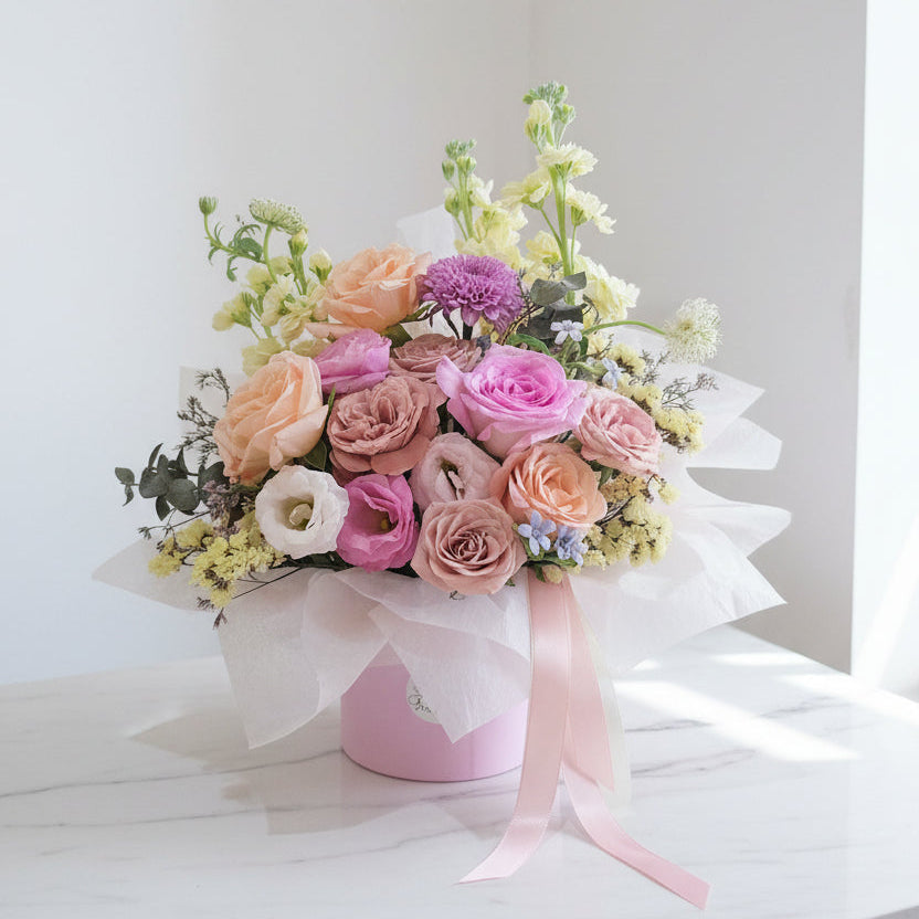 Bespoke pastel-toned rose arrangement in pink hat box, Jiyu Florals Singapore